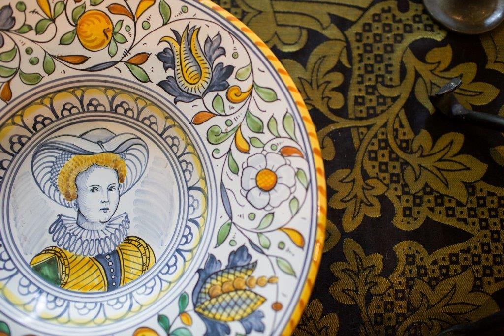 Decorative plate with handpainted picture of historical lady.
