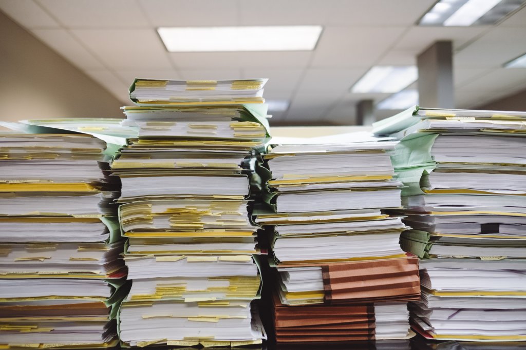 Stacks of documents and files.