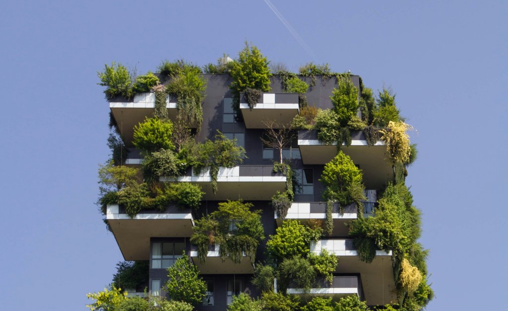 Building with green balconies and roof.